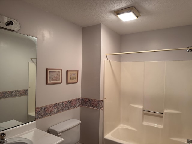 227 Twin Lakes Rd Apt C, North Branford, CT 06471 - bathroom with a textured ceiling, toilet, washtub / shower combination, and vanity