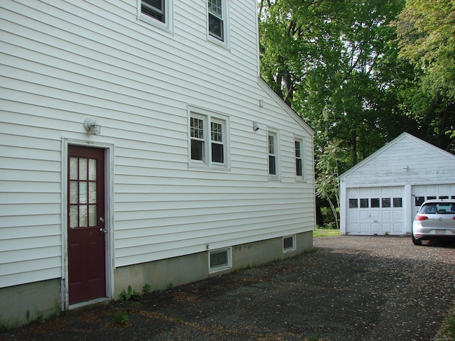 566 Savoy St, Bridgeport, CT 06606 - view of property exterior featuring an outbuilding and a detached garage