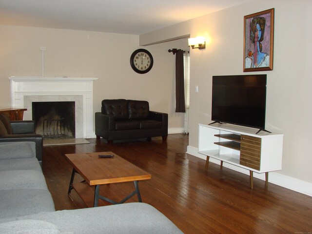 566 Savoy St, Bridgeport, CT 06606 - living room with wood finished floors, a premium fireplace, and baseboards