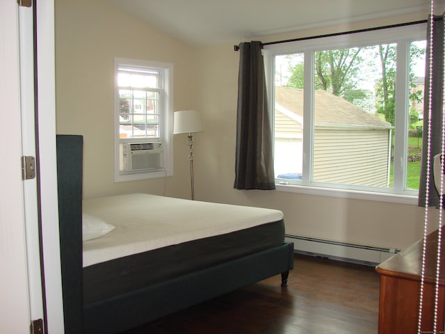 566 Savoy St, Bridgeport, CT 06606 - bedroom featuring a baseboard heating unit, dark wood finished floors, lofted ceiling, and cooling unit