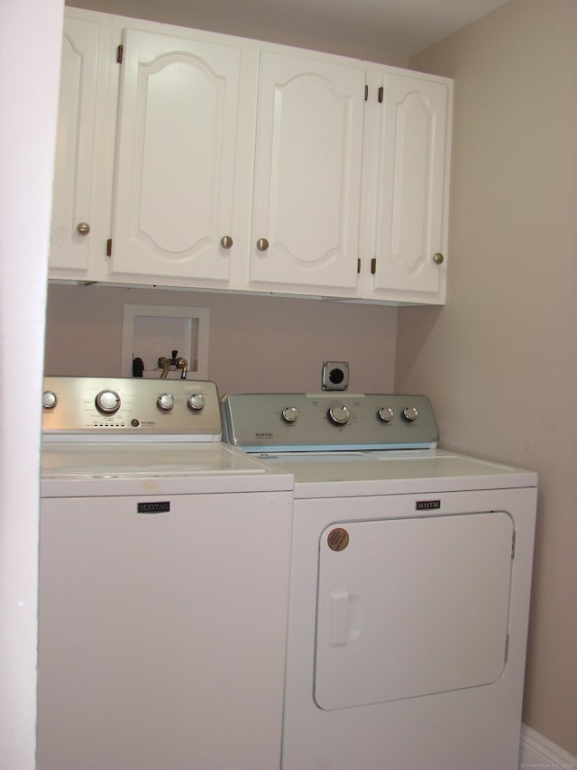 566 Savoy St, Bridgeport, CT 06606 - laundry area with washing machine and dryer and cabinet space