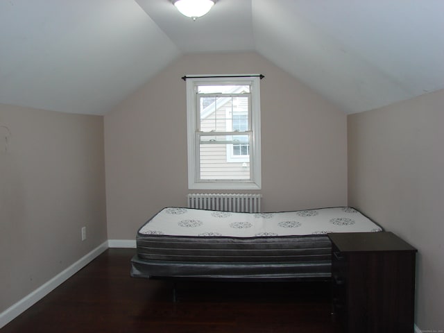 566 Savoy St, Bridgeport, CT 06606 - bedroom featuring radiator heating unit, wood finished floors, vaulted ceiling, and baseboards