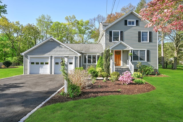 23 Shepherd St, Norwalk, CT 06851 - traditional-style house featuring driveway, a front lawn, and an attached garage