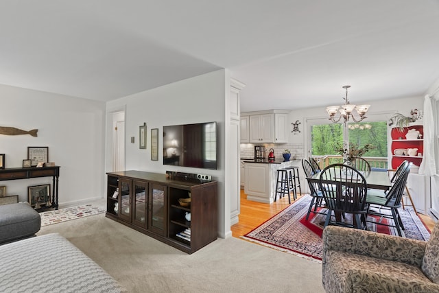 134 W Lake Ave, Guilford, CT 06437 - living room with a chandelier and light colored carpet