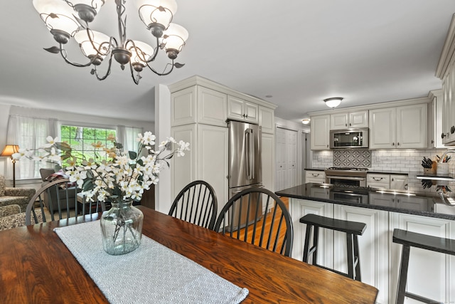 134 W Lake Ave, Guilford, CT 06437 - dining room featuring a chandelier