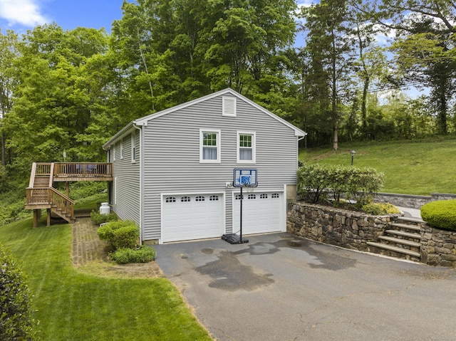 134 W Lake Ave, Guilford, CT 06437 - garage featuring asphalt driveway