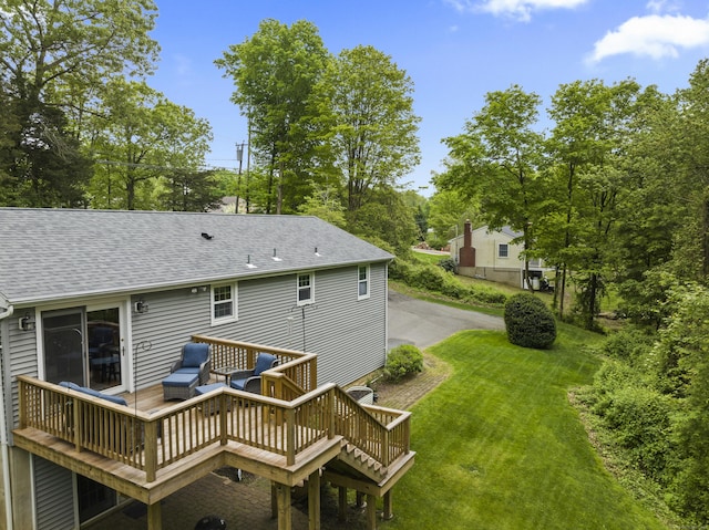 134 W Lake Ave, Guilford, CT 06437 - rear view of house with a wooden deck, a shingled roof, and a yard