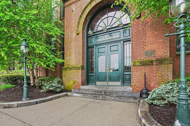 25 Grand St Apt 102, Norwalk, CT 06851 - view of exterior entry with brick siding and french doors