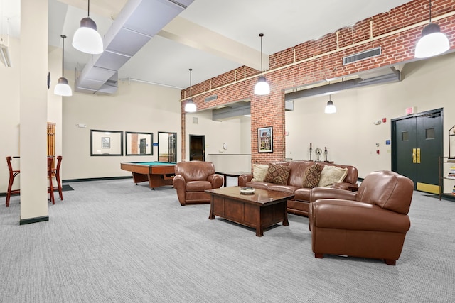 25 Grand St Apt 102, Norwalk, CT 06851 - living room with carpet flooring, brick wall, a towering ceiling, and billiards table