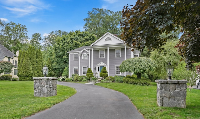 28 Eagle Dr, Fairfield, CT 06825 - greek revival house with a front yard and asphalt driveway