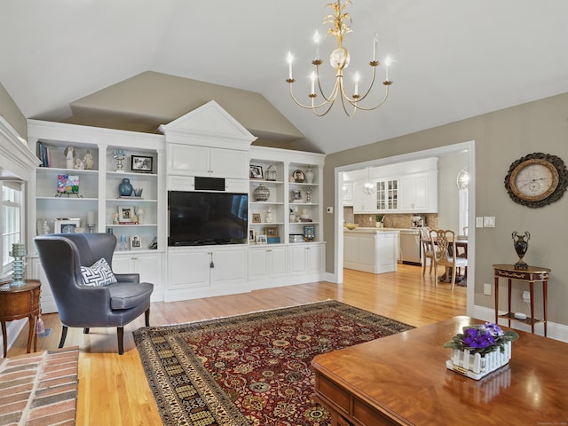 28 Eagle Dr, Fairfield, CT 06825 - living area featuring a chandelier, light wood finished floors, and vaulted ceiling