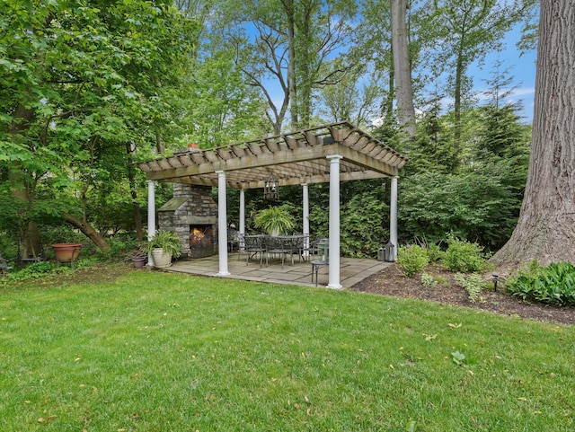 28 Eagle Dr, Fairfield, CT 06825 - view of grassy yard featuring an outdoor stone fireplace, a pergola, and a patio area