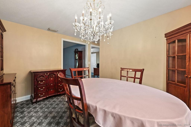 154 Sims Rd, Bristol, CT 06010 - dining space featuring a chandelier, baseboards, and dark colored carpet