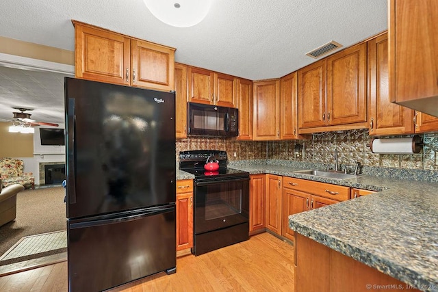 154 Sims Rd, Bristol, CT 06010 - kitchen featuring black appliances, a sink, a ceiling fan, light wood-type flooring, and brown cabinetry