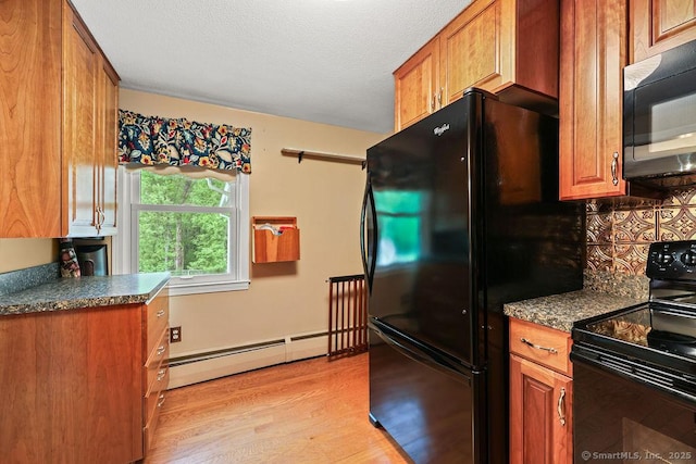 154 Sims Rd, Bristol, CT 06010 - kitchen with black appliances, baseboard heating, light wood-style floors, and brown cabinetry