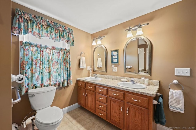 154 Sims Rd, Bristol, CT 06010 - bathroom featuring tile patterned flooring, toilet, double vanity, and baseboards