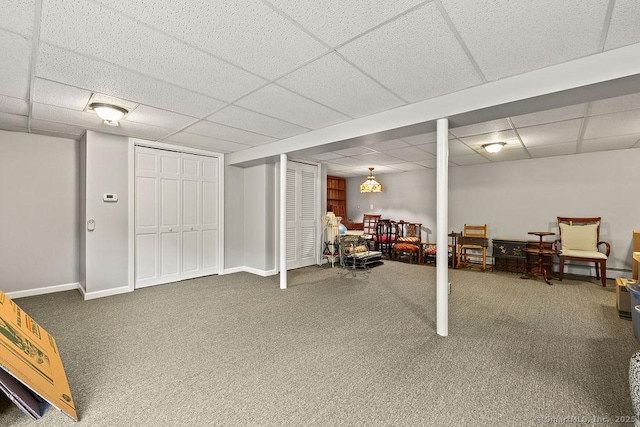 154 Sims Rd, Bristol, CT 06010 - finished below grade area with a paneled ceiling, carpet, and baseboards