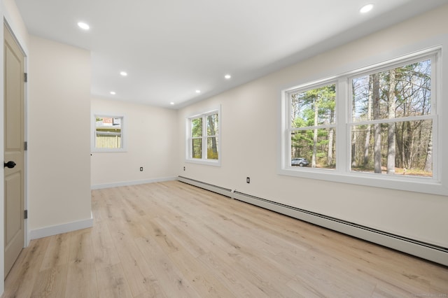 132 Bailey Pond Rd, Voluntown, CT 06384 - unfurnished room with a baseboard heating unit, light wood-type flooring, recessed lighting, and baseboards