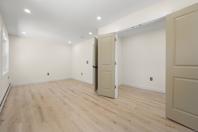 132 Bailey Pond Rd, Voluntown, CT 06384 - basement with light wood-type flooring, recessed lighting, baseboards, and a baseboard heating unit