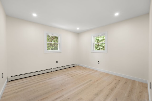 132 Bailey Pond Rd, Voluntown, CT 06384 - spare room featuring a baseboard heating unit, wood finished floors, recessed lighting, and baseboards