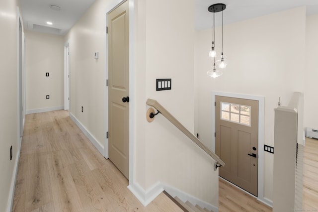 132 Bailey Pond Rd, Voluntown, CT 06384 - entryway featuring light wood-type flooring, baseboard heating, and baseboards