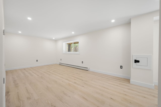 132 Bailey Pond Rd, Voluntown, CT 06384 - below grade area featuring a baseboard heating unit, light wood-style flooring, recessed lighting, and baseboards