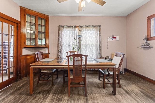 245 Ledyard St, New London, CT 06320 - dining space with dark wood-style floors, ceiling fan, and baseboards