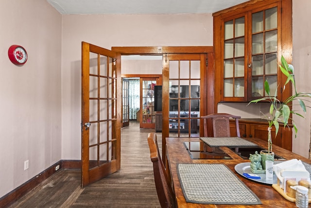 245 Ledyard St, New London, CT 06320 - dining space featuring french doors, dark wood-type flooring, and baseboards