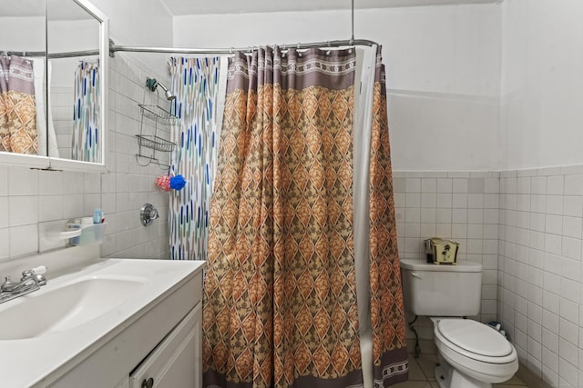 245 Ledyard St, New London, CT 06320 - bathroom featuring tile walls, vanity, toilet, a shower with shower curtain, and tile patterned floors