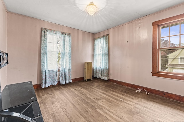245 Ledyard St, New London, CT 06320 - unfurnished room featuring radiator, hardwood / wood-style floors, and baseboards