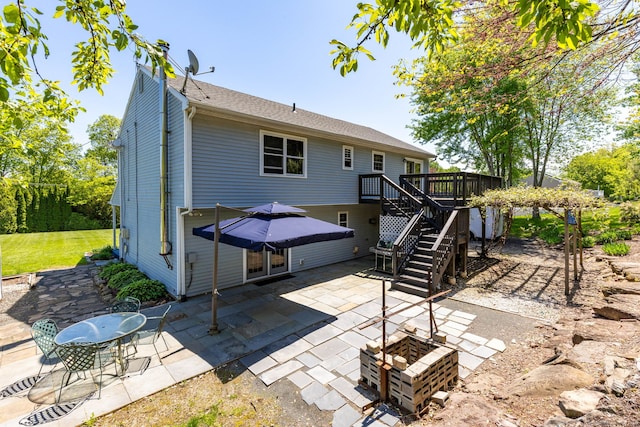 10 Spoonville Rd, East Granby, CT 06026 - rear view of property featuring a patio, stairway, a deck, and roof with shingles