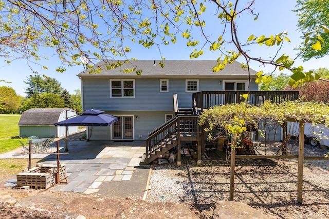 10 Spoonville Rd, East Granby, CT 06026 - rear view of property with stairway, a wooden deck, and a patio