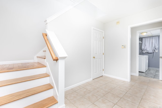 10 Spoonville Rd, East Granby, CT 06026 - stairs with washer / clothes dryer, tile patterned flooring, and baseboards