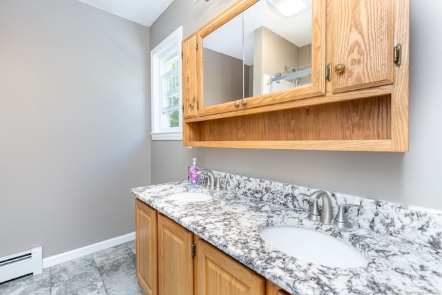 10 Spoonville Rd, East Granby, CT 06026 - full bathroom with a baseboard heating unit, baseboards, and double vanity
