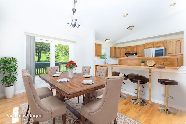 10 Spoonville Rd, East Granby, CT 06026 - dining room featuring lofted ceiling, light wood-type flooring, and baseboards
