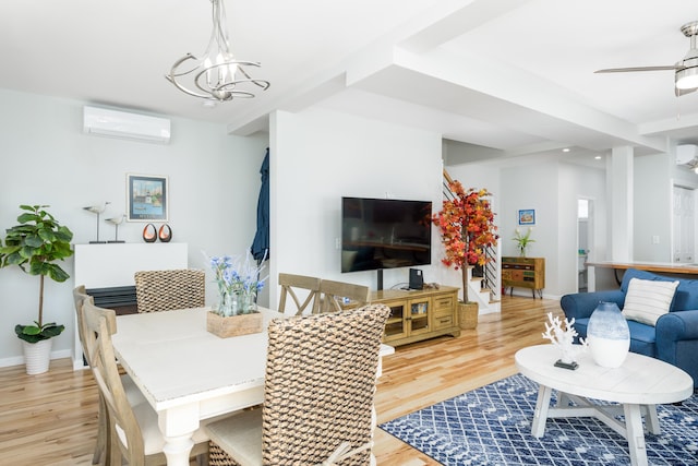 276 Niantic River Rd, Waterford, CT 06385 - living room featuring a wall mounted AC, light wood finished floors, stairs, and a ceiling fan