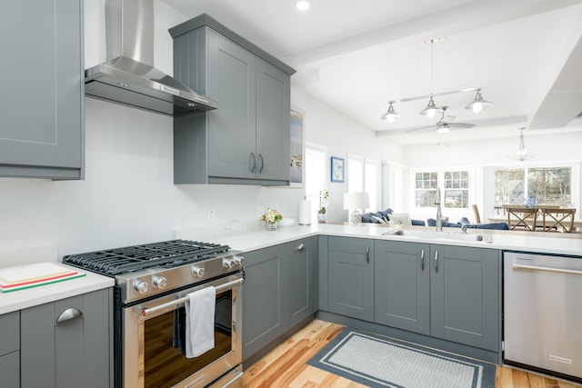 276 Niantic River Rd, Waterford, CT 06385 - kitchen featuring stainless steel appliances, wall chimney exhaust hood, a ceiling fan, and light countertops