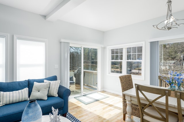 276 Niantic River Rd, Waterford, CT 06385 - living room featuring light wood finished floors and a chandelier