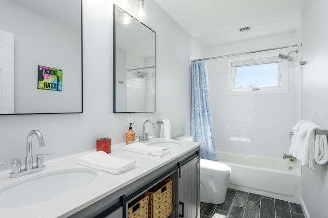 276 Niantic River Rd, Waterford, CT 06385 - bathroom with shower / bath combo with shower curtain, double vanity, and wood tiled floors