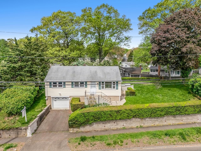 261 High St, Fairfield, CT 06824 - view of front facade featuring driveway and a garage