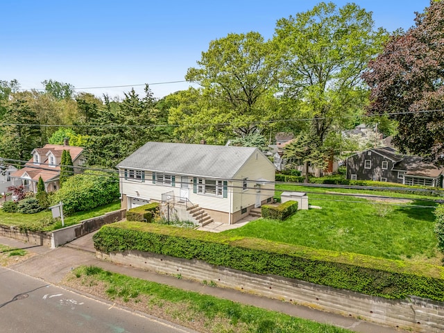 261 High St, Fairfield, CT 06824 - view of front facade with an attached garage and driveway