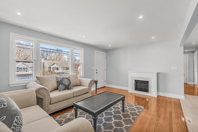 261 High St, Fairfield, CT 06824 - living area with wood finished floors, recessed lighting, a fireplace, and baseboards