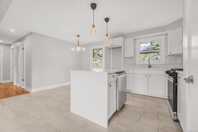261 High St, Fairfield, CT 06824 - kitchen with stove, stainless steel dishwasher, a sink, light countertops, and decorative backsplash
