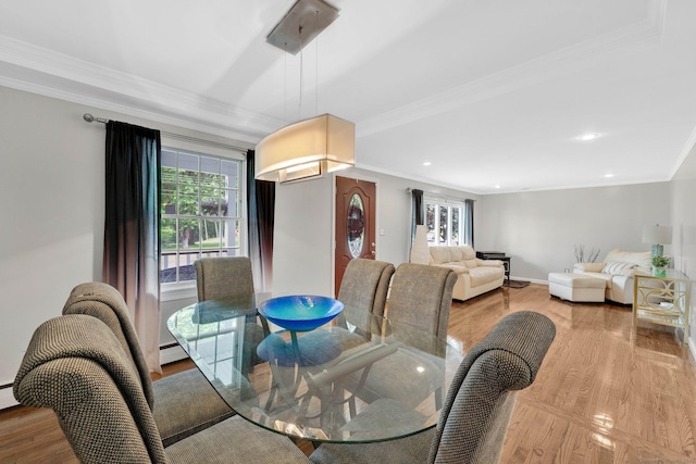 dining space featuring plenty of natural light, light wood finished floors, ornamental molding, recessed lighting, and baseboards