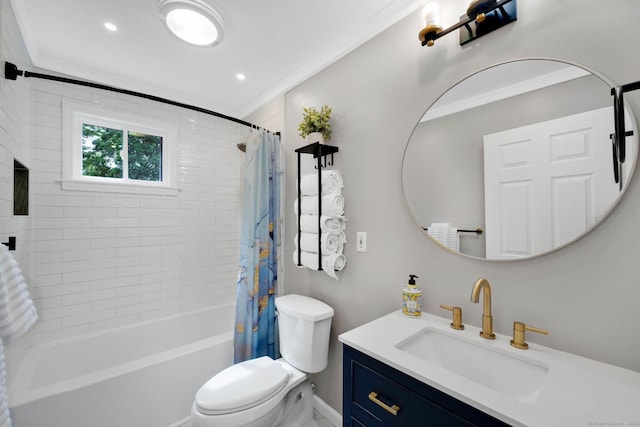 full bathroom with ornamental molding, toilet, vanity, shower / tub combo, and baseboards