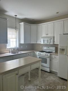6 Aspen Way, Bristol, CT 06010 - kitchen featuring white appliances, a sink, light countertops, decorative light fixtures, and white cabinets