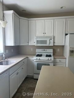 6 Aspen Way, Bristol, CT 06010 - kitchen with white appliances, a sink, white cabinetry, decorative light fixtures, and light countertops