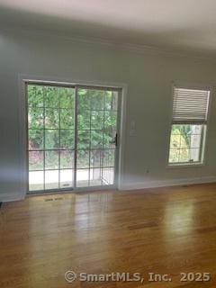 6 Aspen Way, Bristol, CT 06010 - empty room featuring wood finished floors, baseboards, and crown molding