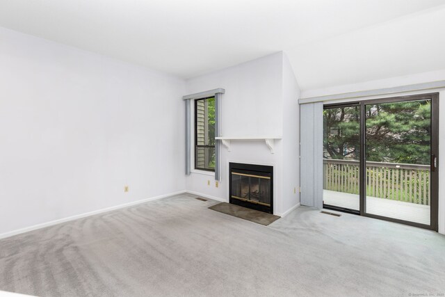 85 Metacomet Dr Unit 85, Meriden, CT 06450 - unfurnished living room with carpet floors, a fireplace with flush hearth, and baseboards