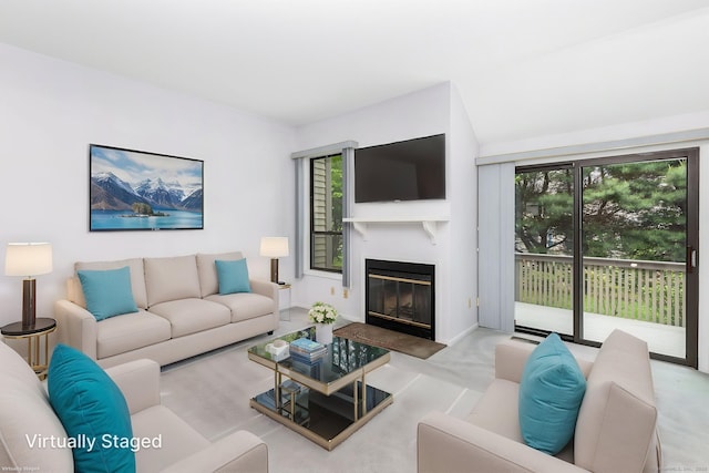 85 Metacomet Dr Unit 85, Meriden, CT 06450 - living room featuring plenty of natural light, a glass covered fireplace, and baseboards